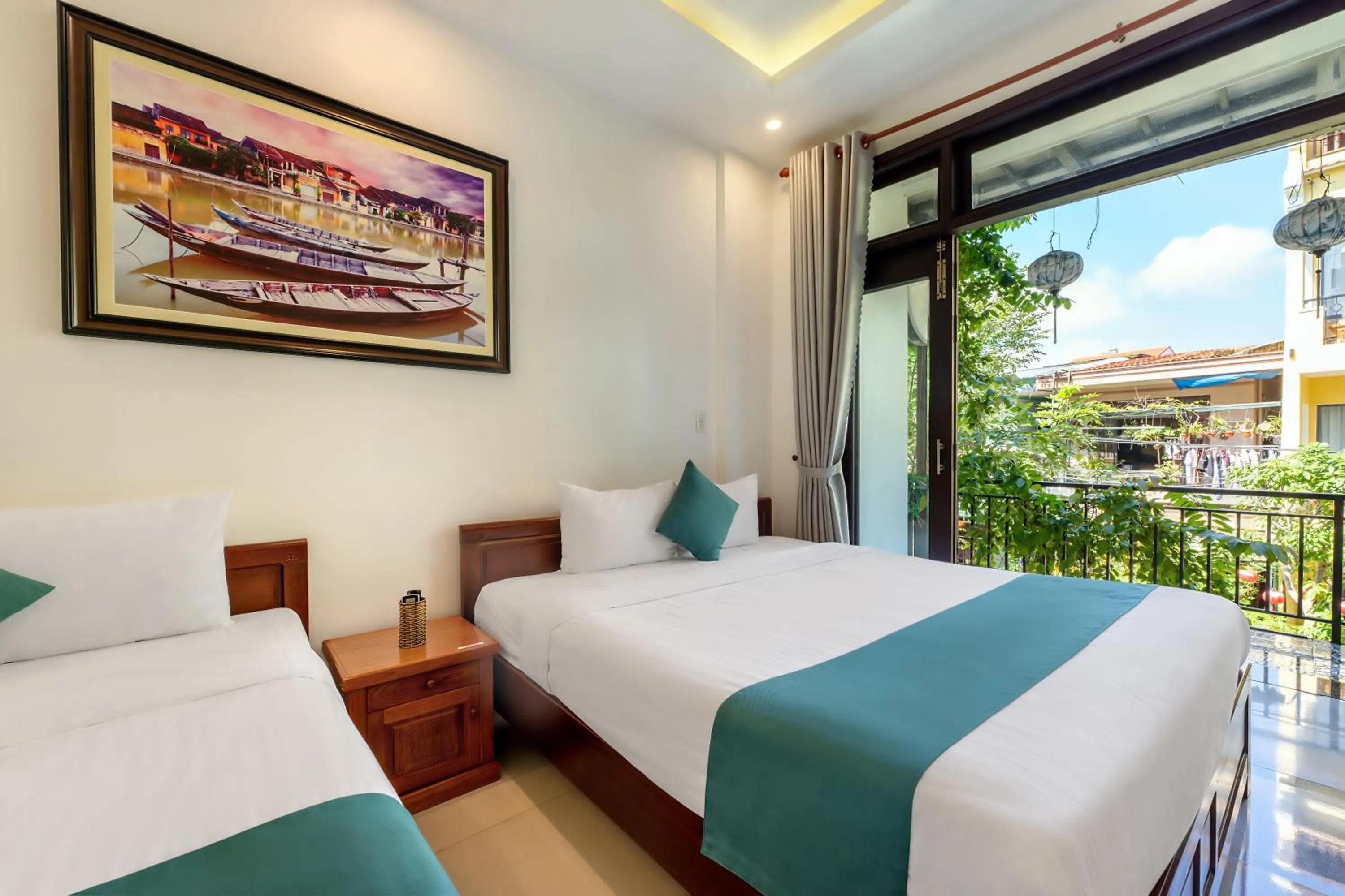 Bed in Rockmouse Centre River Villa Hoi An