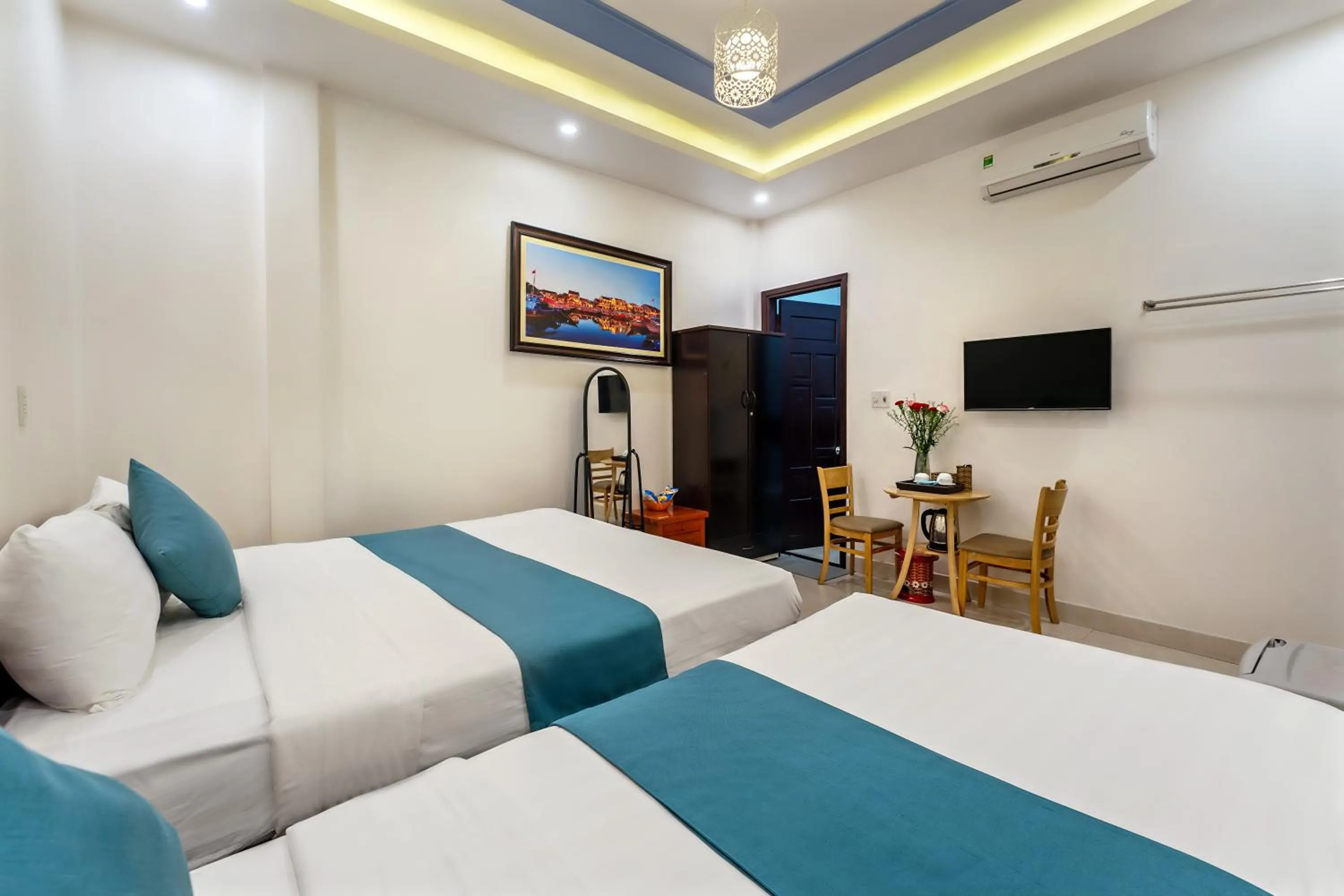 Communal lounge/ TV room, Bed in Rockmouse Centre River Villa Hoi An