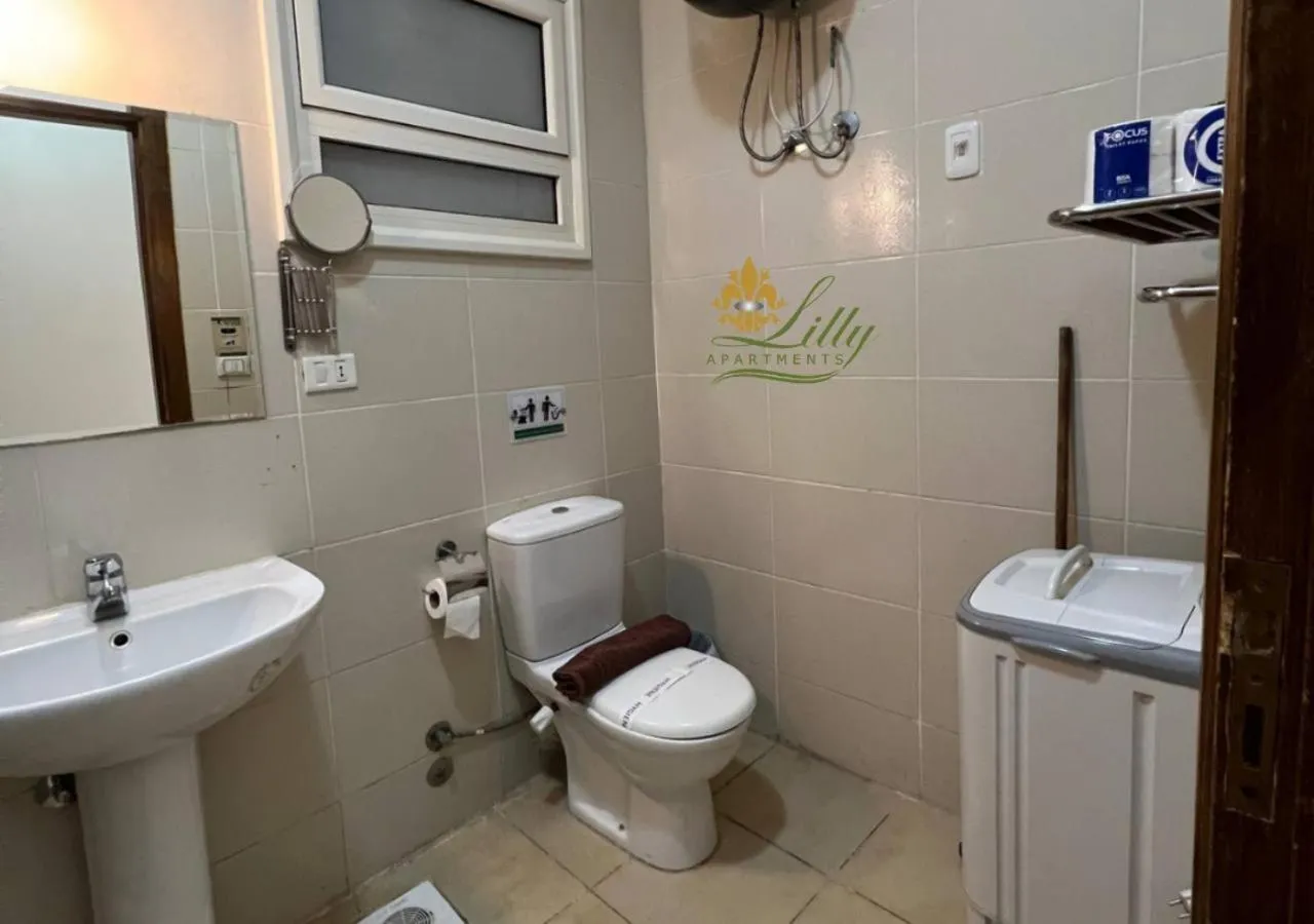 Toilet in Lilly Apartments