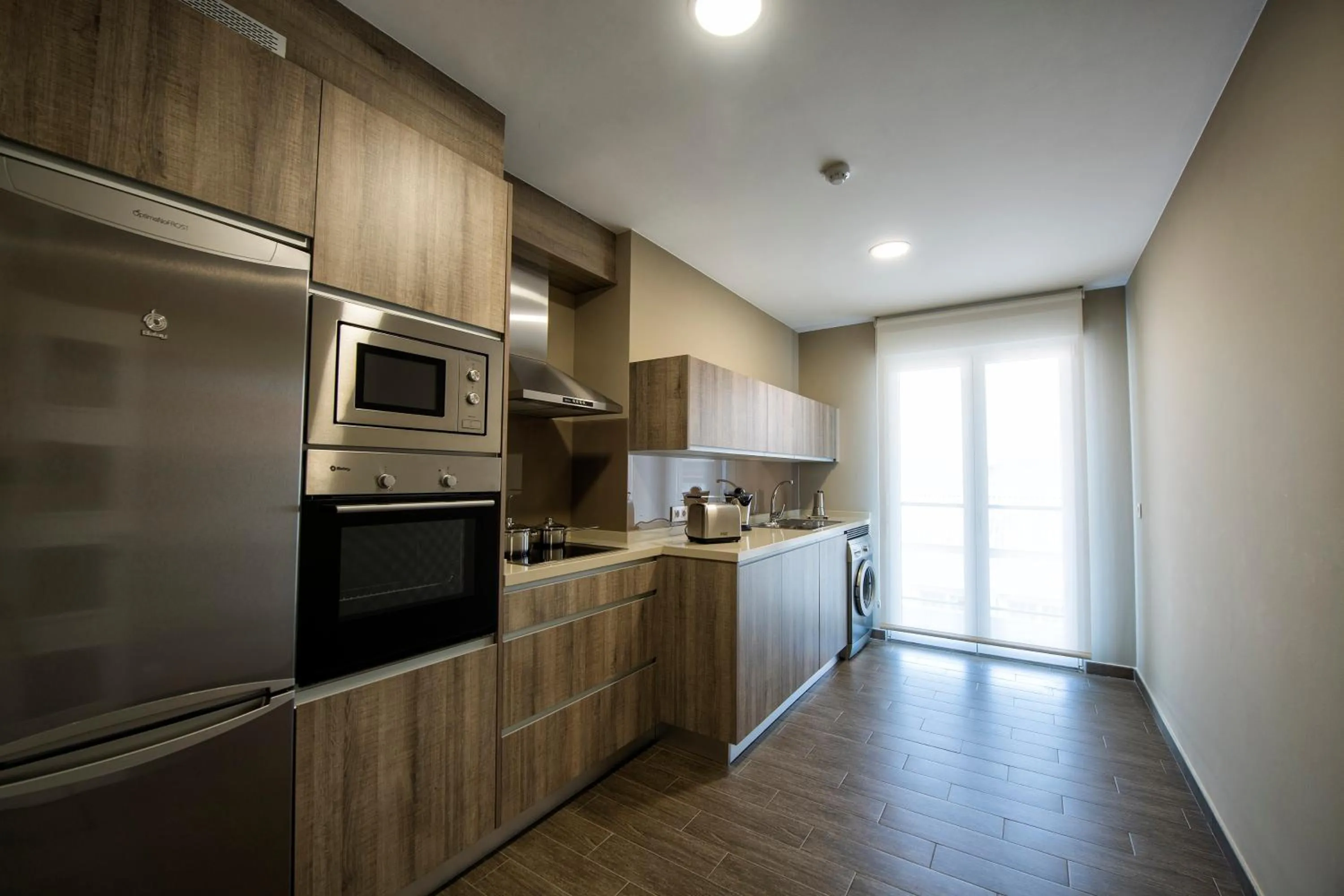 Kitchen or kitchenette in Apartamentos VIDA Mar de Laxe