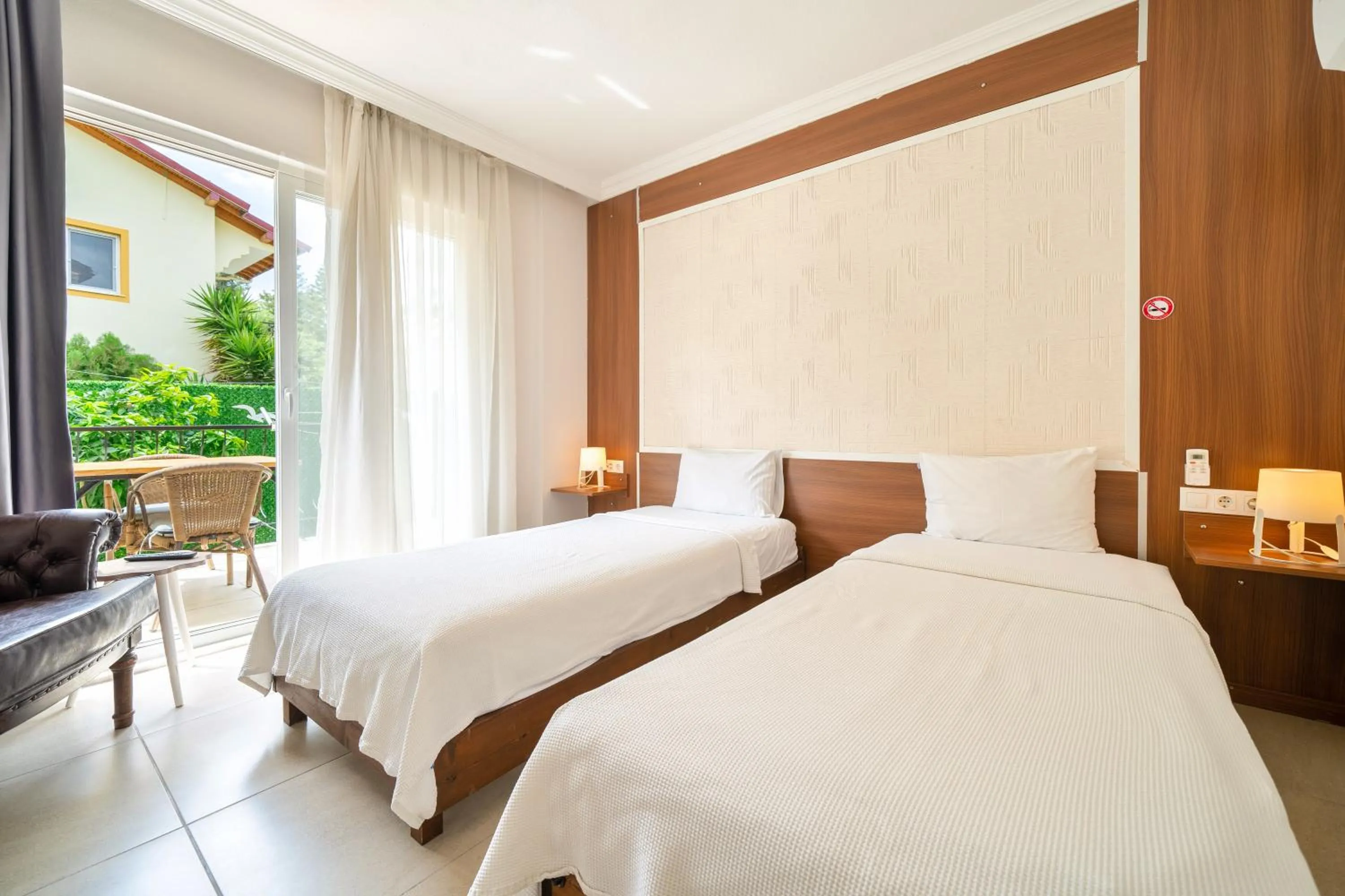 Bed in Dedeminn Garden Hotel