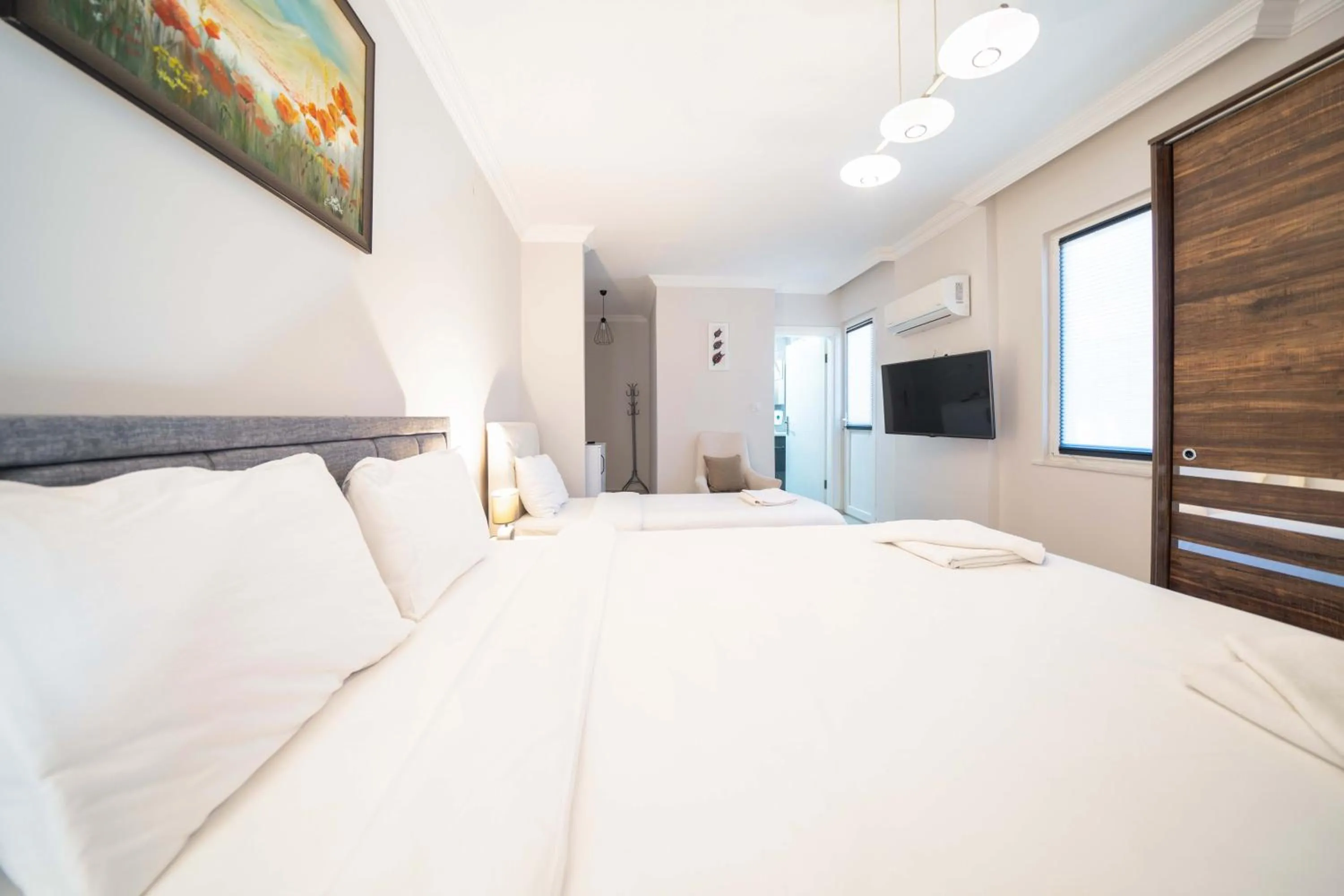 Bed in Dedeminn Garden Hotel