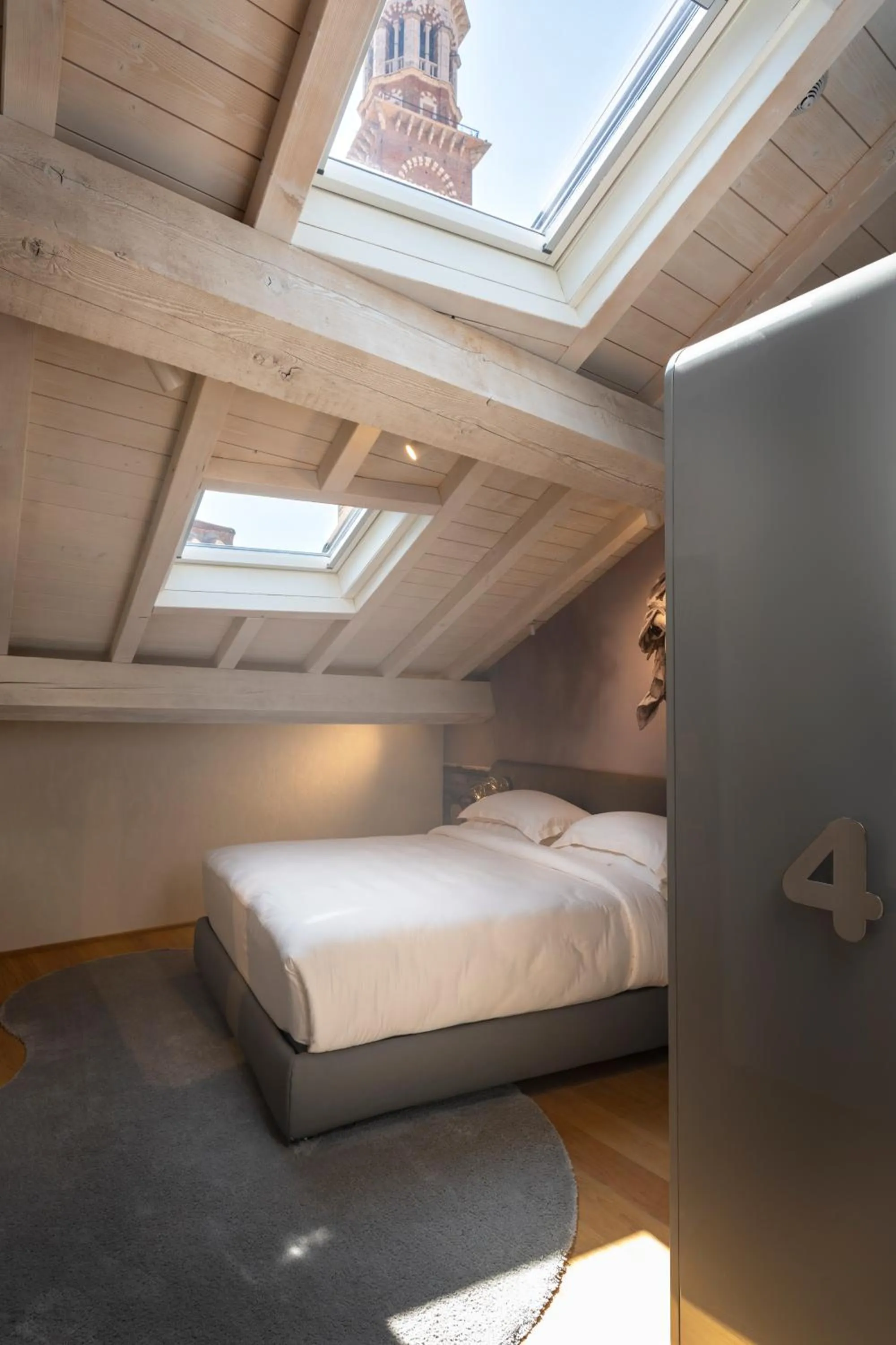 Bed in Lords of Verona Luxury Apartments