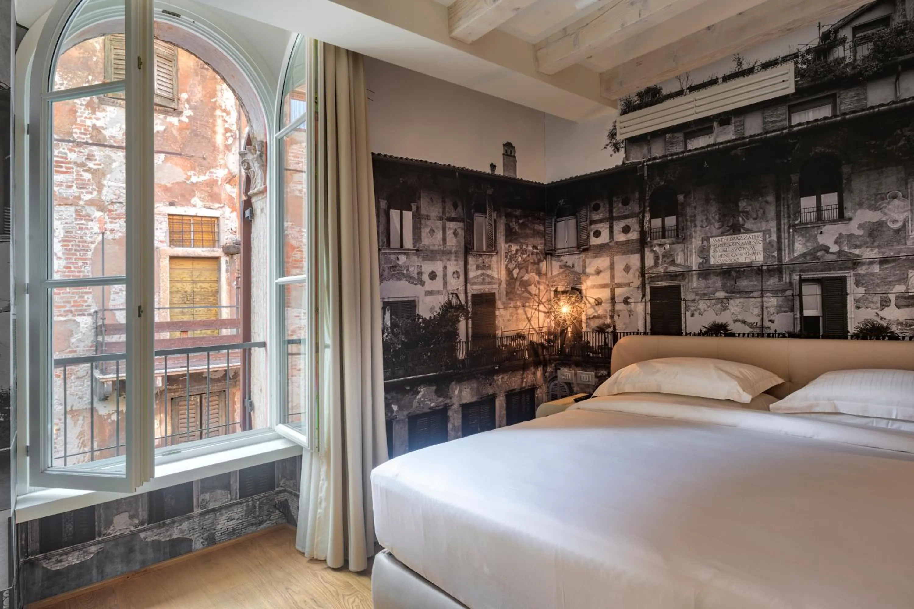 Bed in Lords of Verona Luxury Apartments