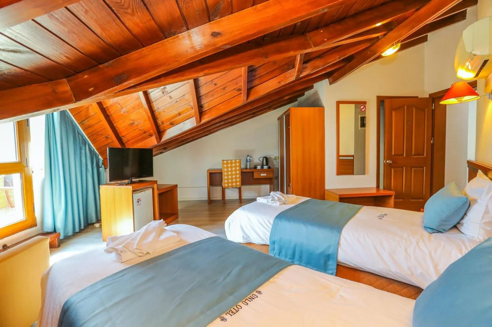 Photo of the whole room, Bed in Gocek Unlu Hotel