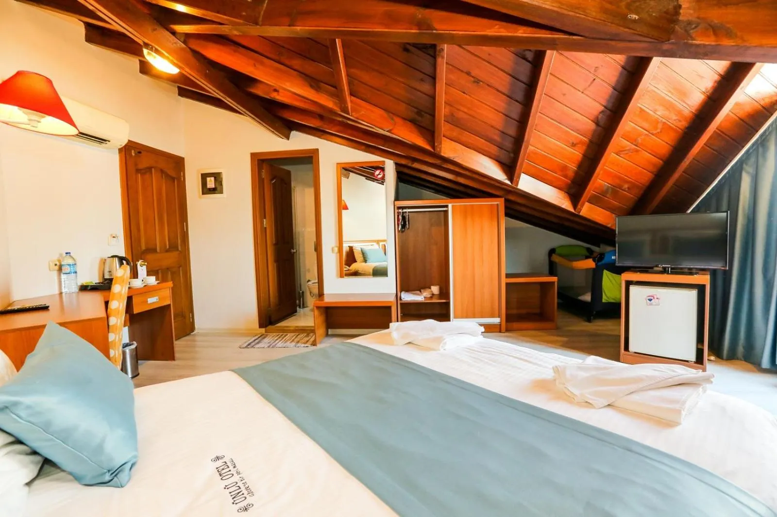 Photo of the whole room, Bed in Gocek Unlu Hotel