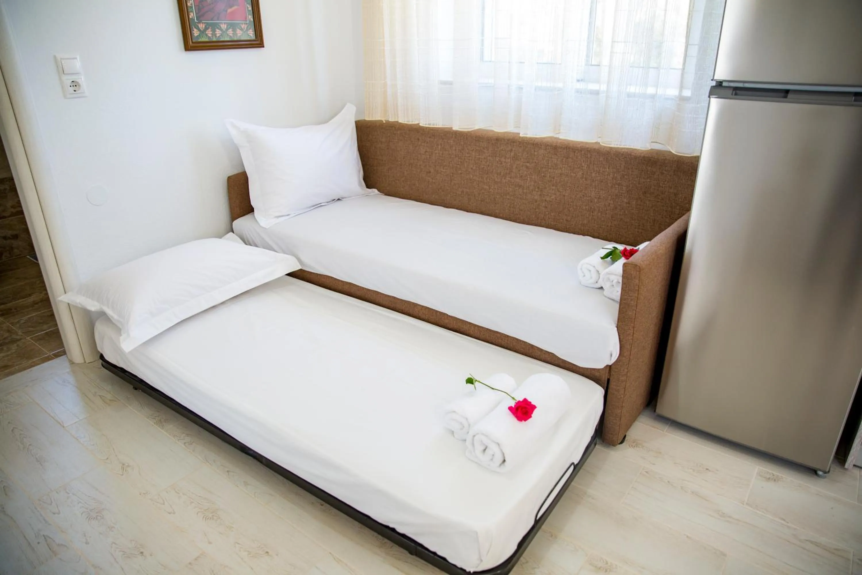 Bed in Haraki Stone Apartments