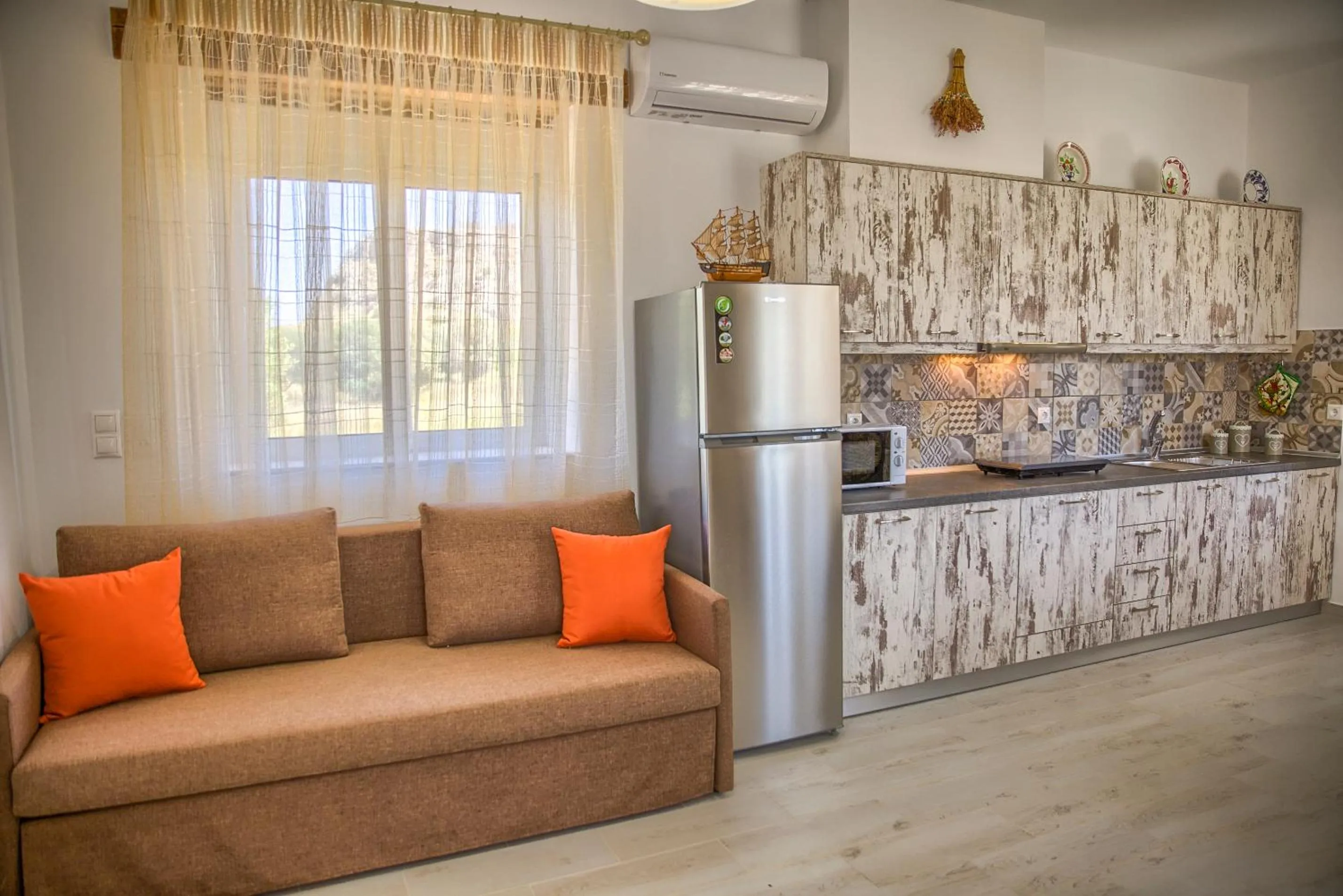 Bed in Haraki Stone Apartments