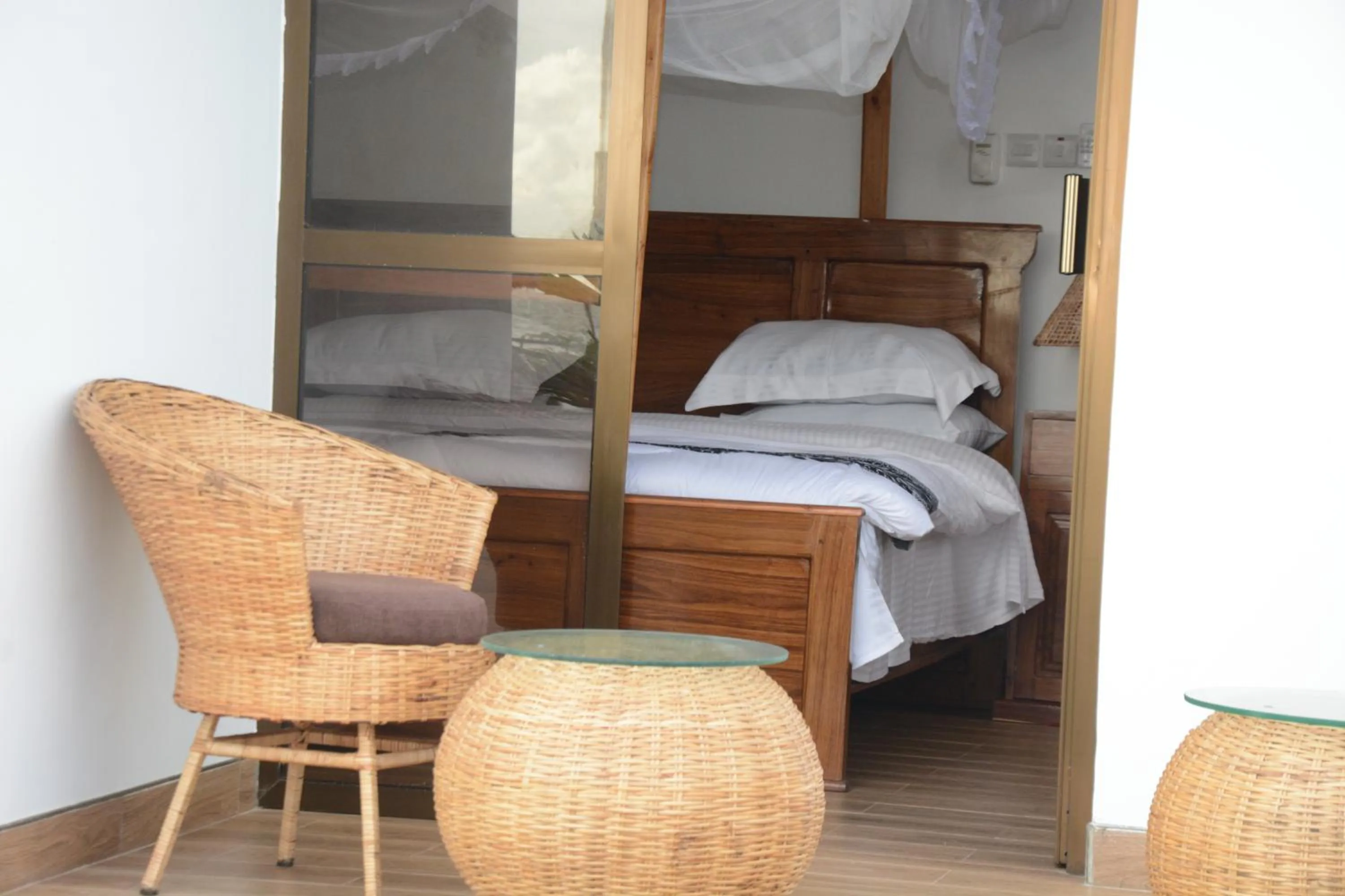 Patio, Bed in Villa Dahl Beach Resort