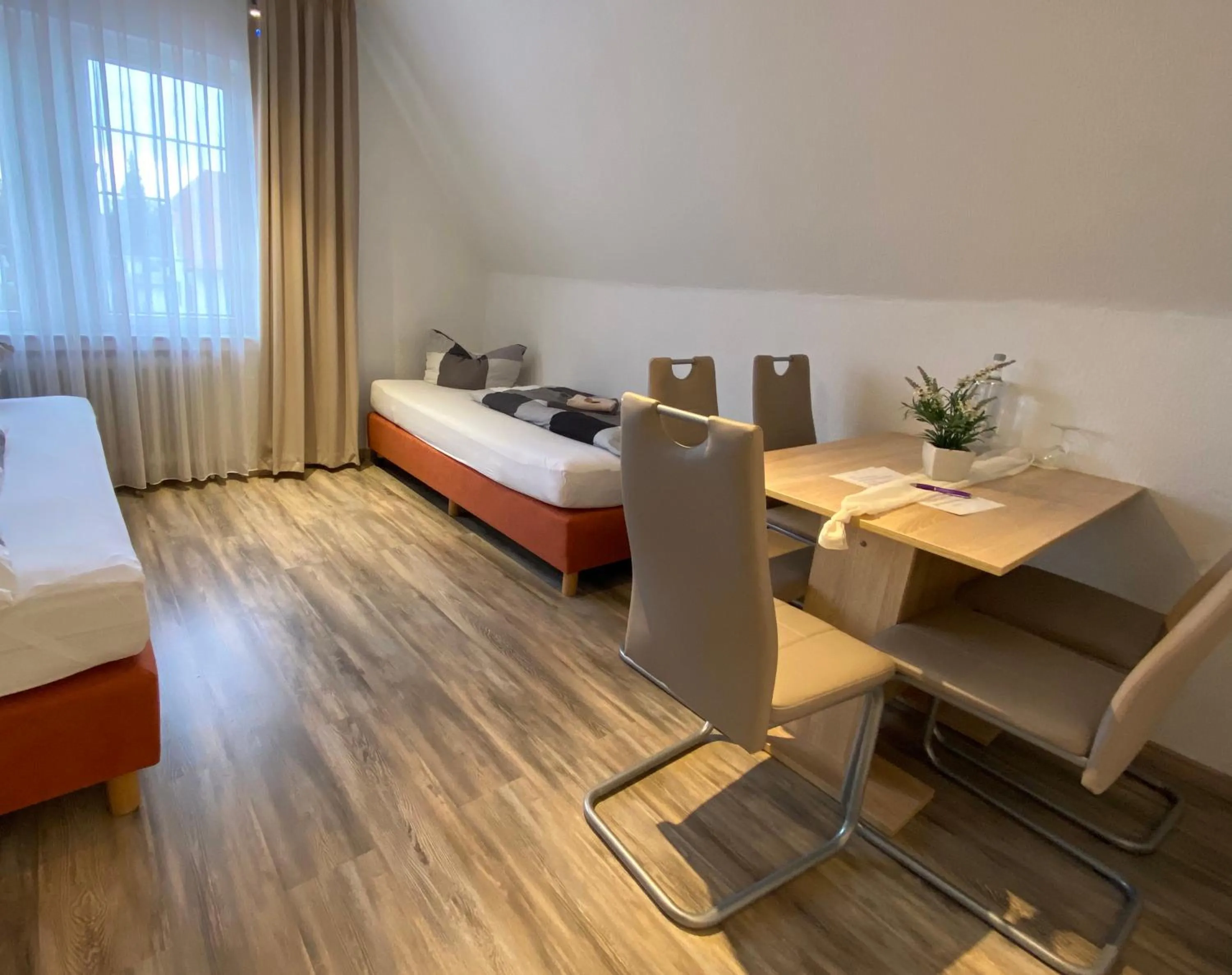 Living room, Bed in Wilsmann Apartmentvermietung