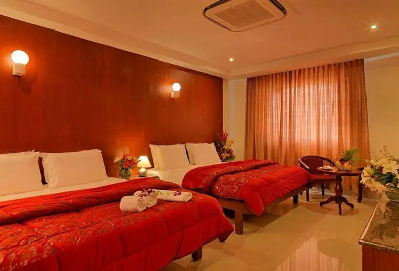 Bedroom, Bed in Dhanunjayas Luxury Hotel