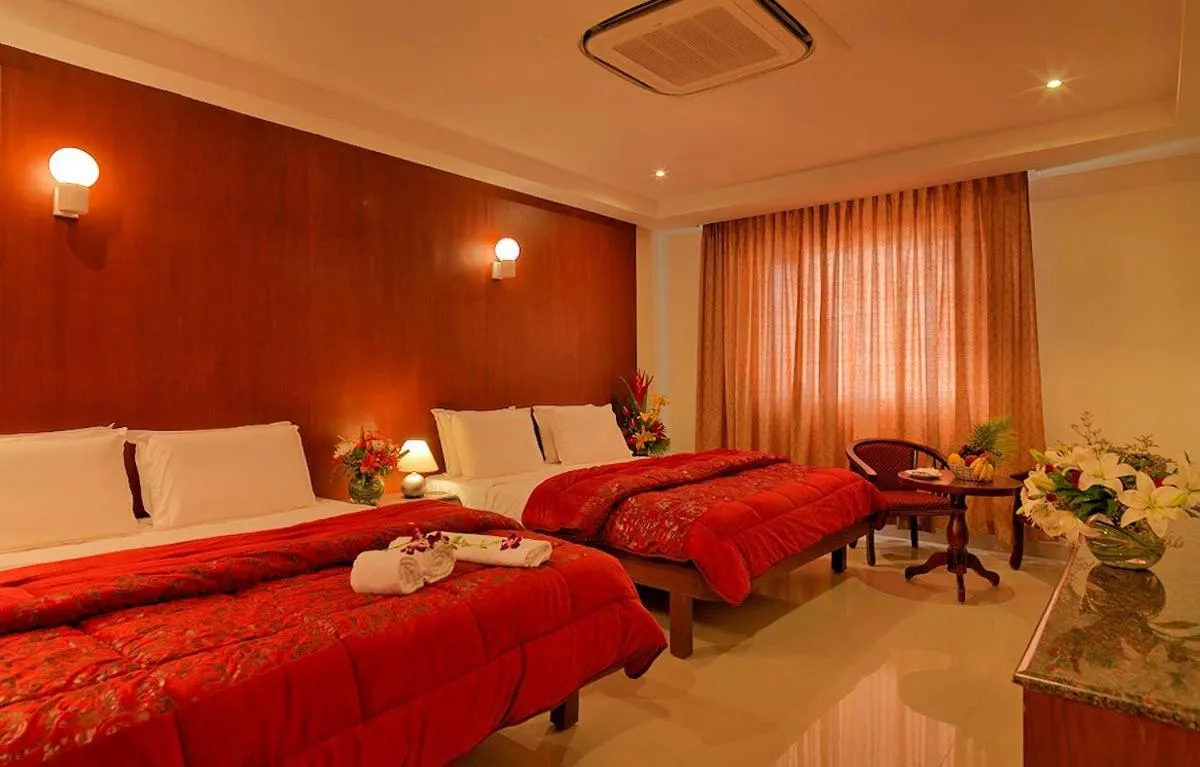 Bed in Dhanunjayas Luxury Hotel