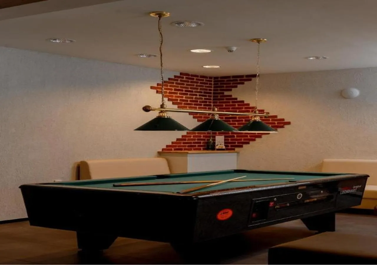 Communal lounge/ TV room in Alpenhotel Edelweiss