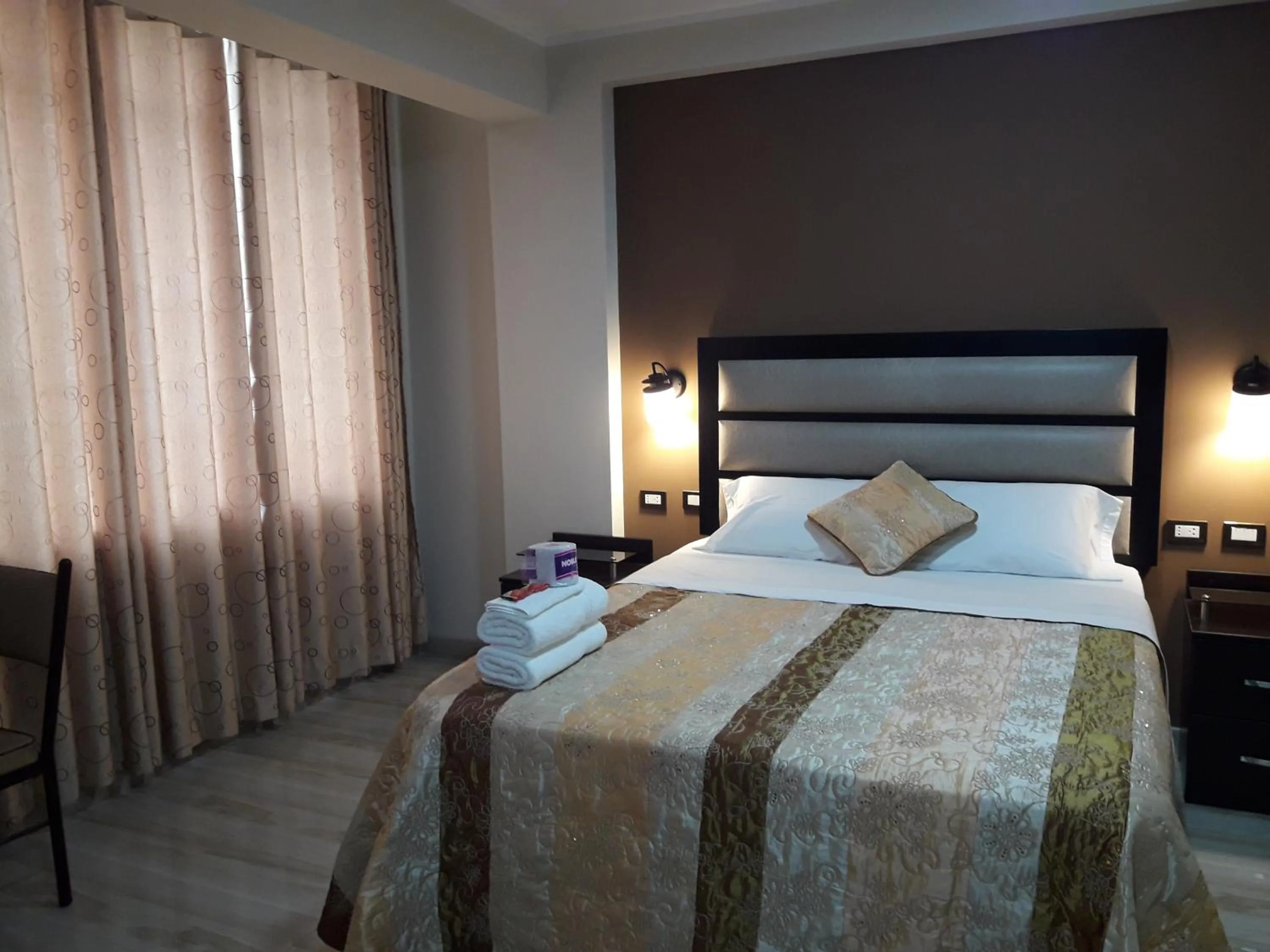 Bed in Gavina Inn Hotel