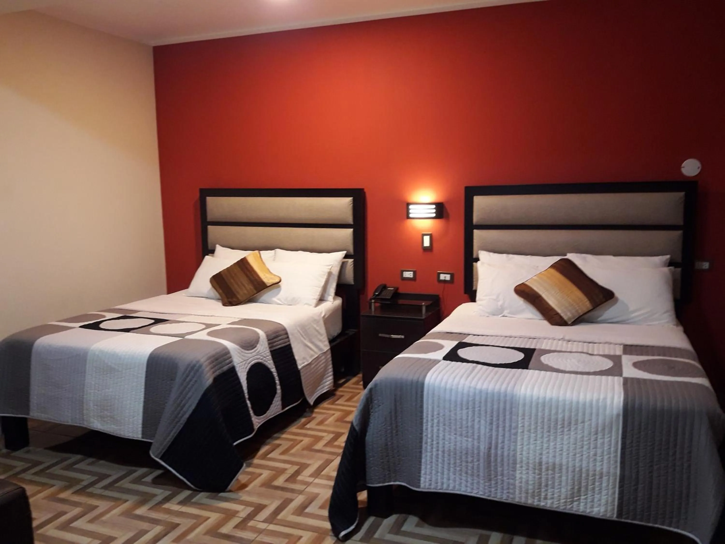 Bed in Gavina Inn Hotel