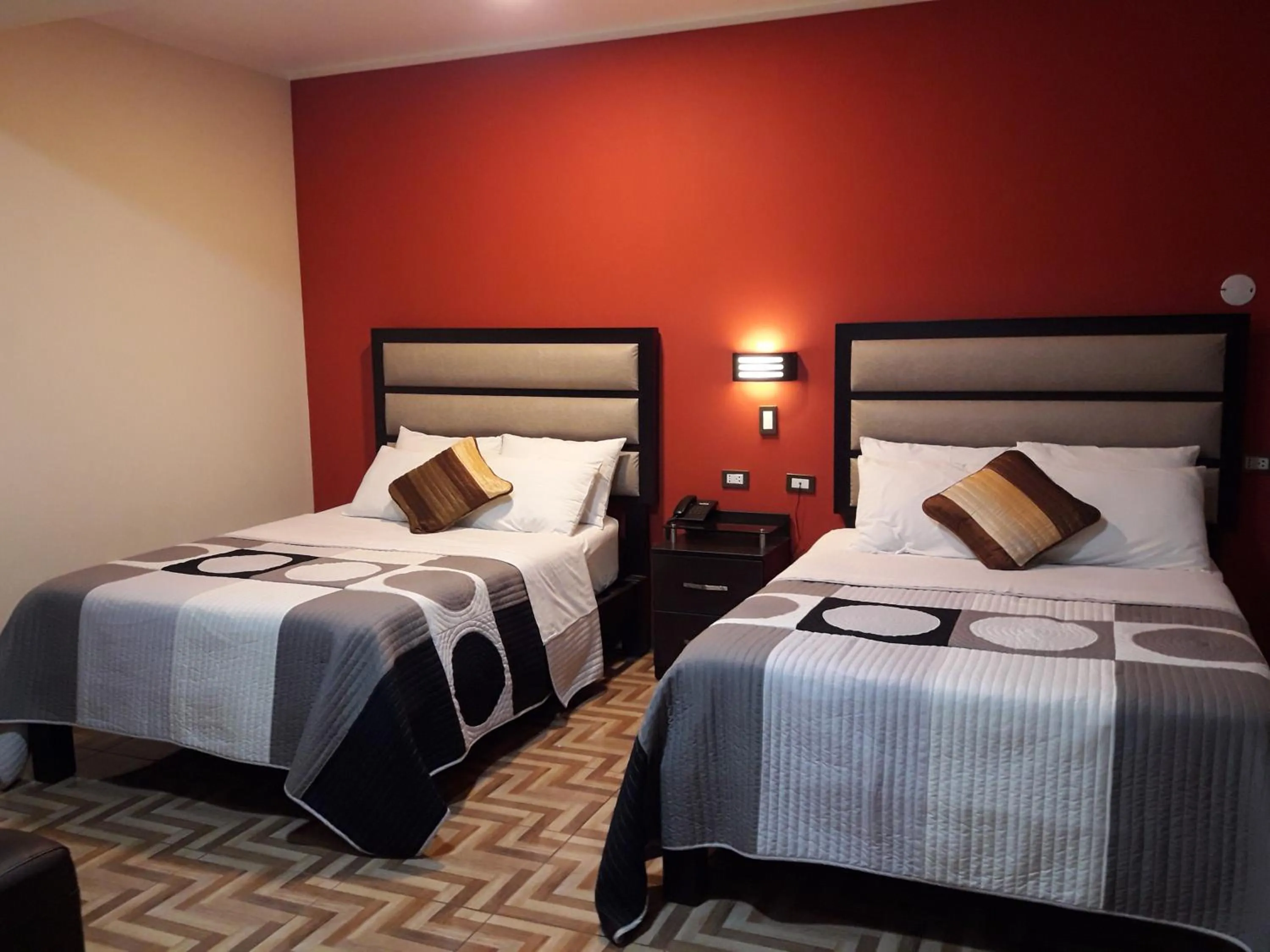 Bed in Gavina Inn Hotel