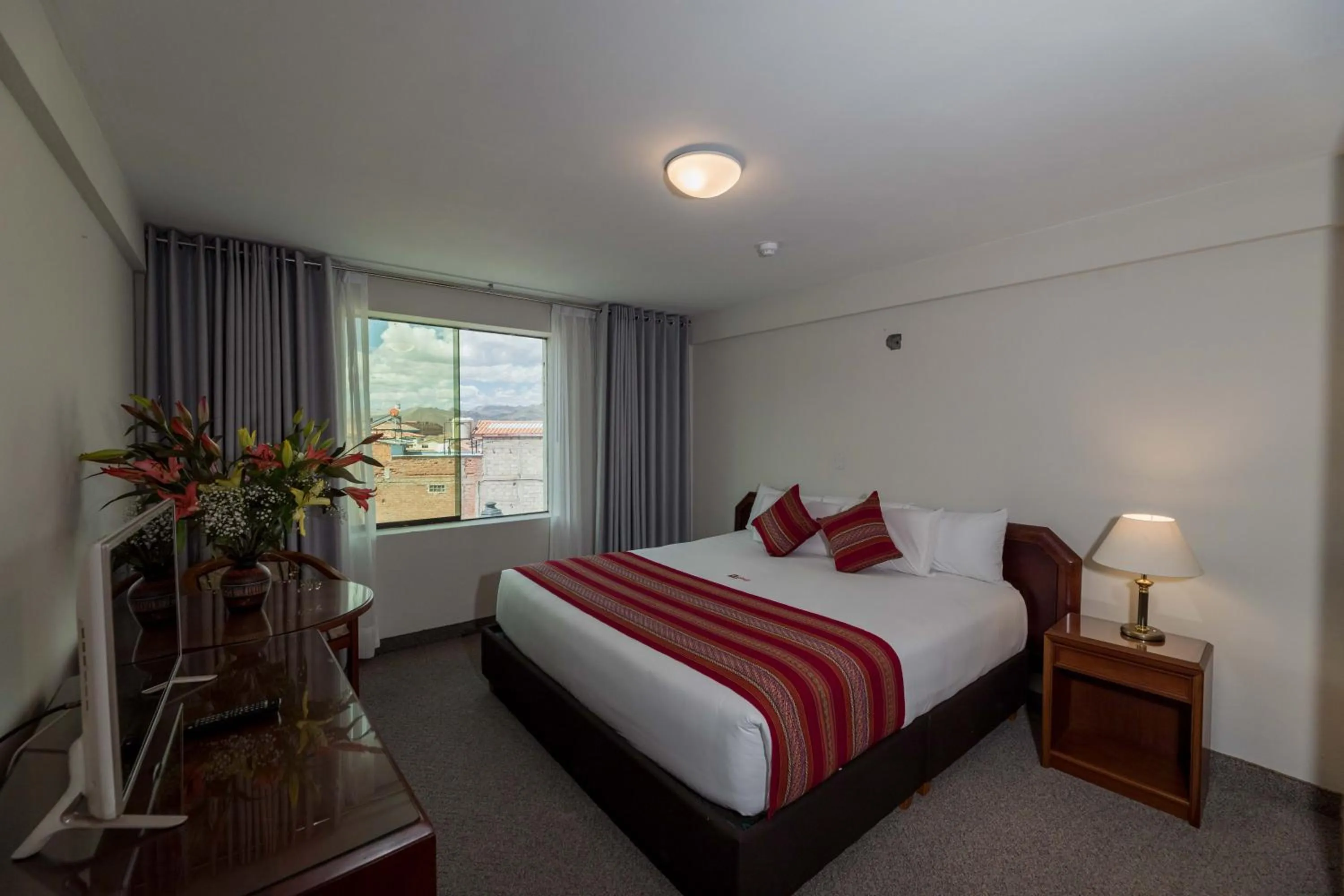 Bed in Quechua Plaza Hotel