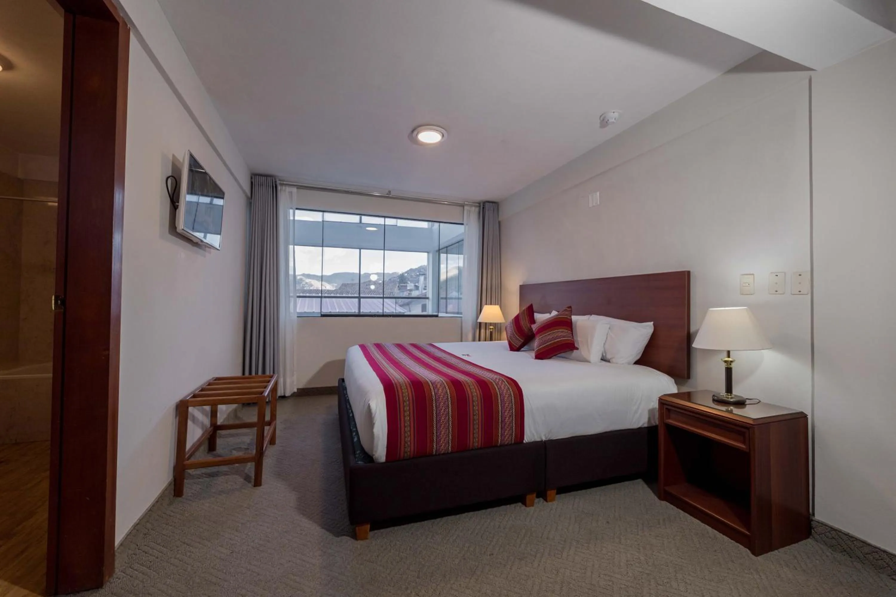 Bed in Quechua Plaza Hotel