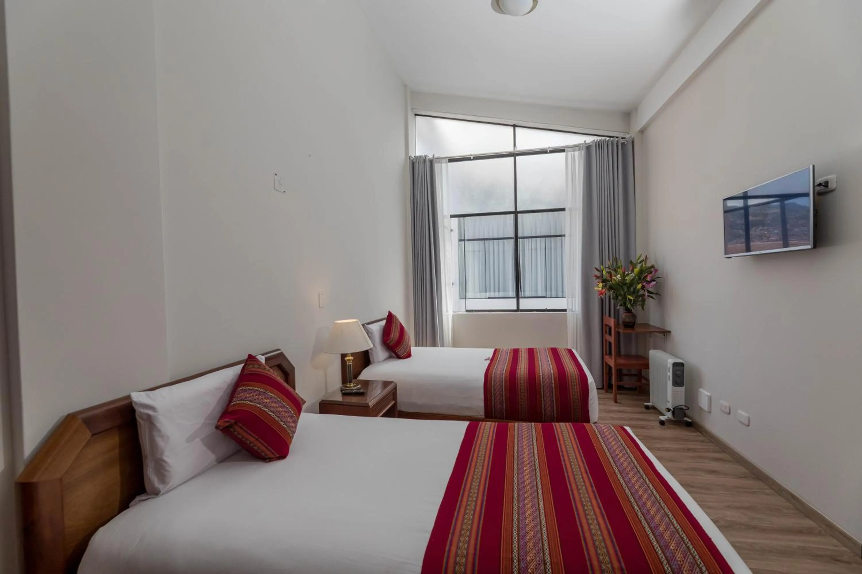 Bed in Quechua Plaza Hotel