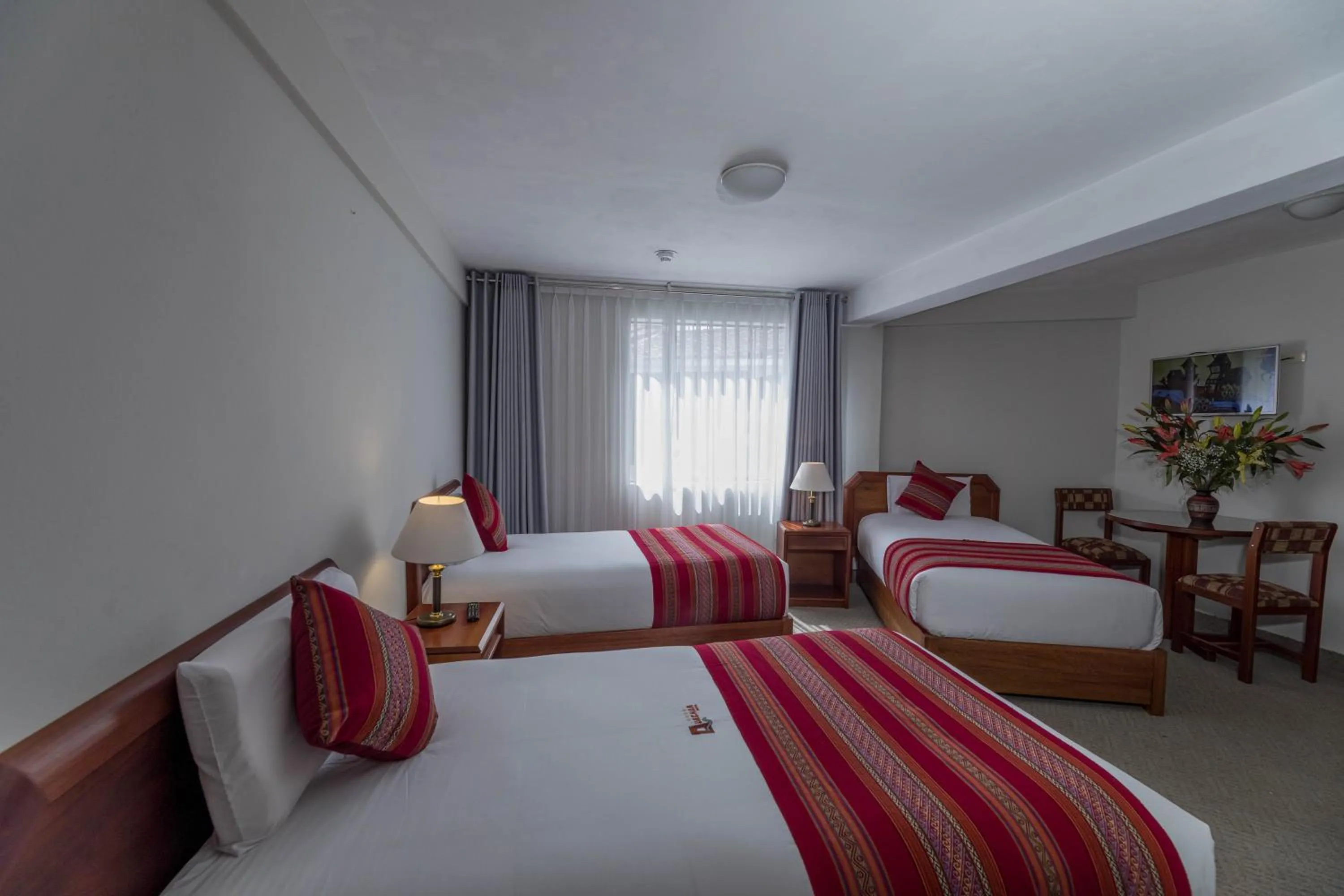 Bed in Quechua Plaza Hotel