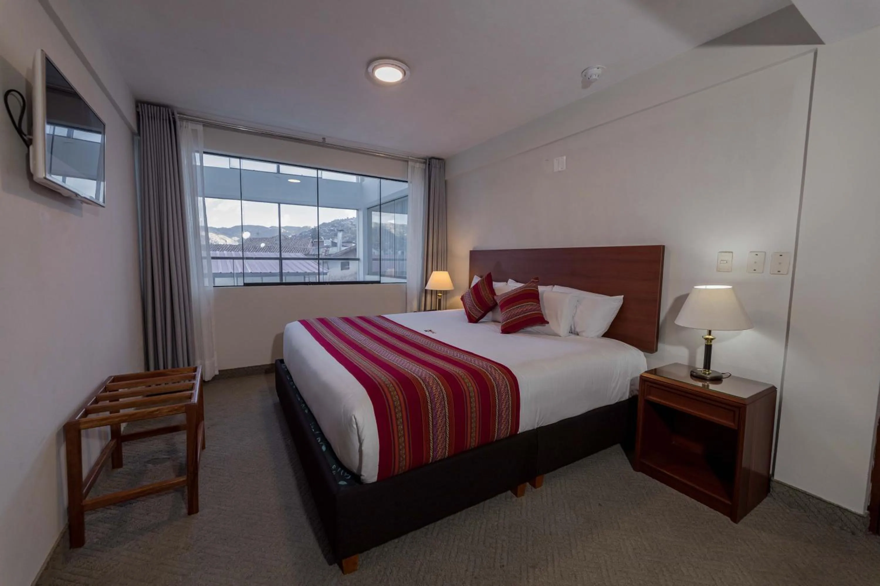 Bed in Quechua Plaza Hotel