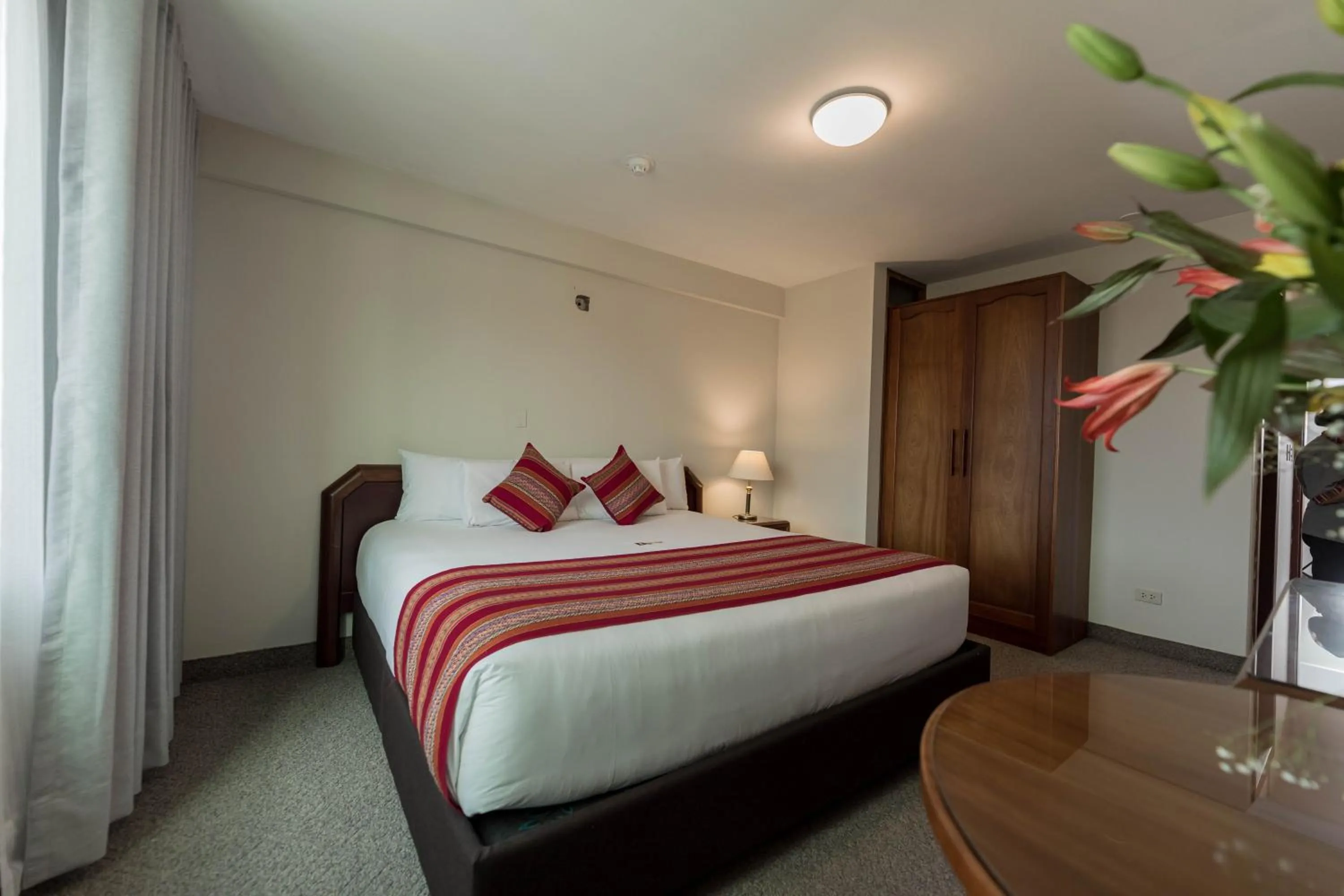 Bed in Quechua Plaza Hotel