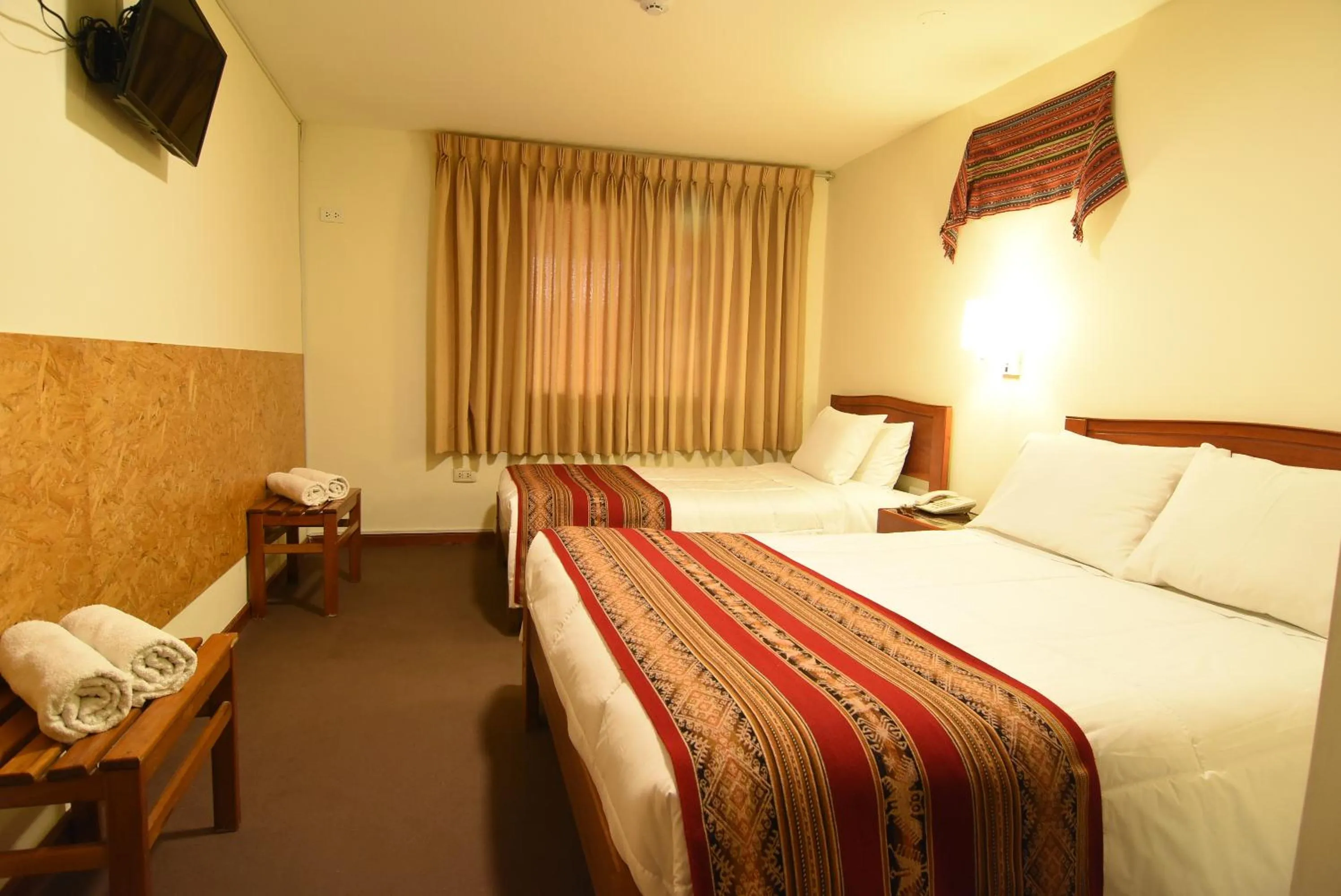 Bed in Hotel Prisma Cusco