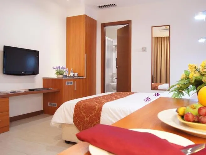 Bed in Gloria Swiss Hotel & Apartment Sandakan
