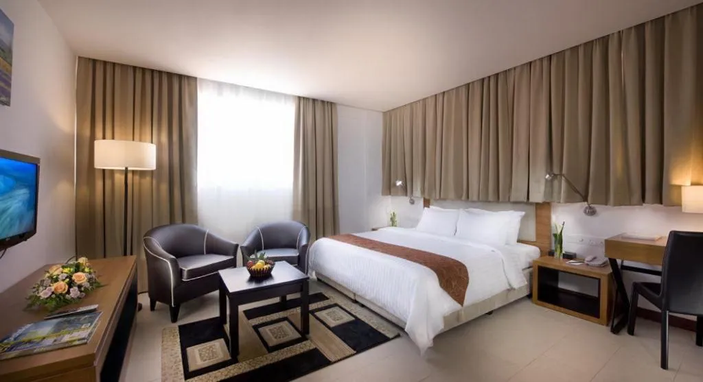 Bed in Gloria Swiss Hotel & Apartment Sandakan