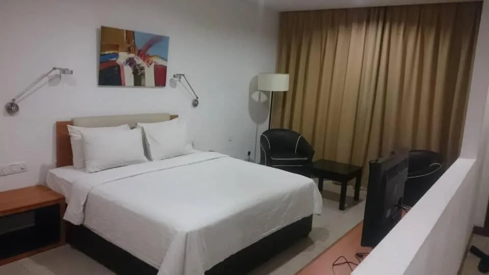 Bed in Gloria Swiss Hotel & Apartment Sandakan