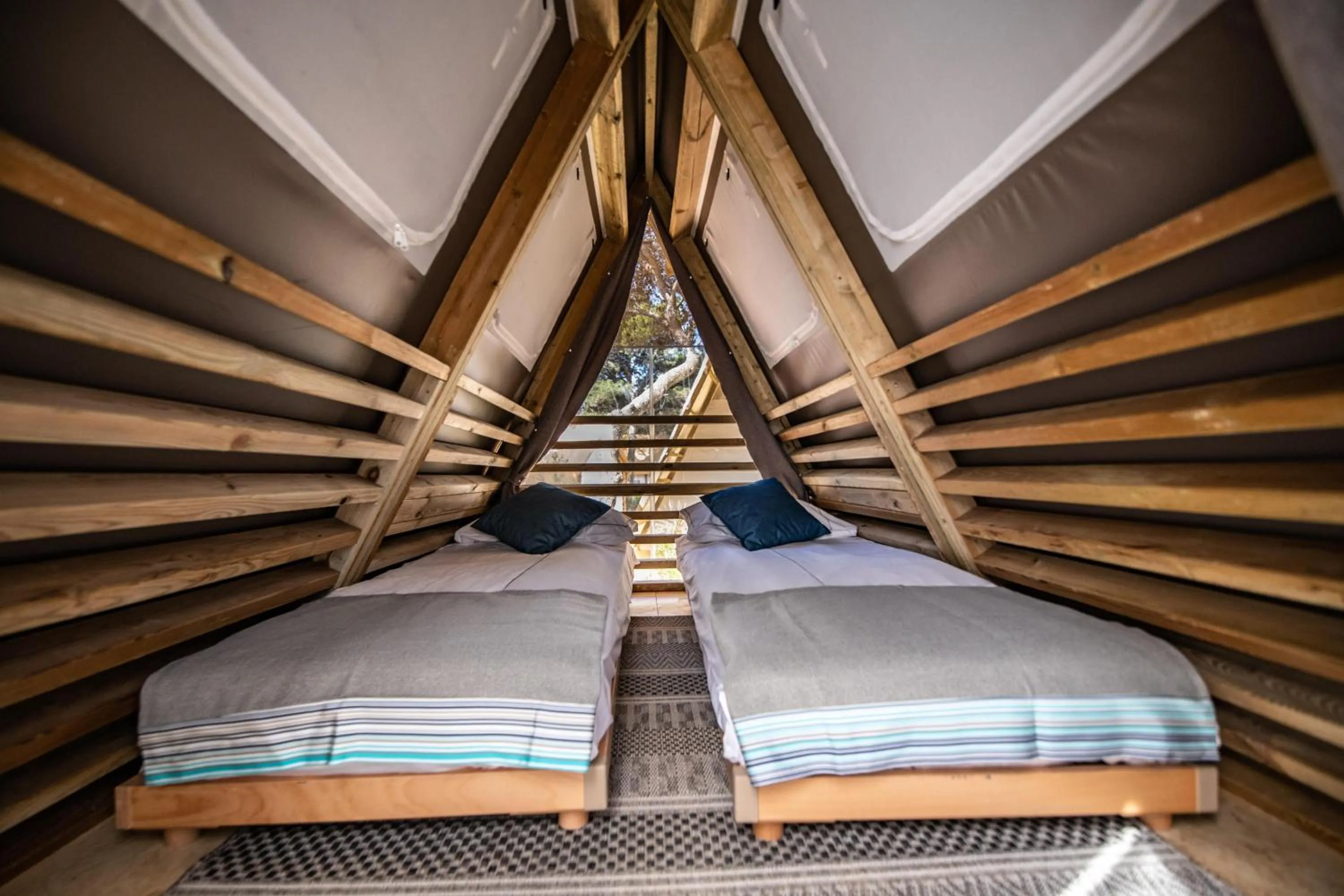 Bed in Arena One 99 Glamping