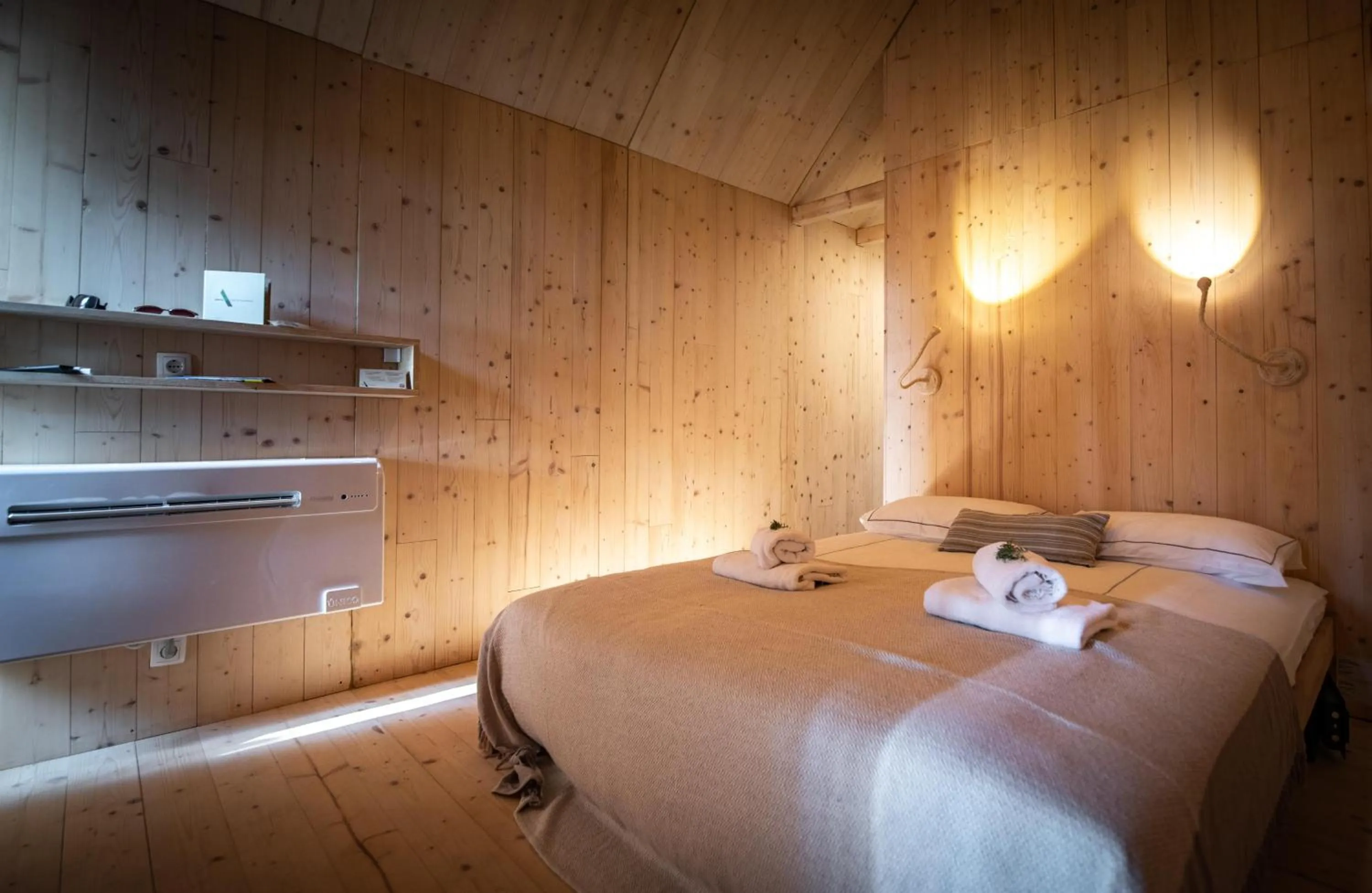 Bed in Arena One 99 Glamping