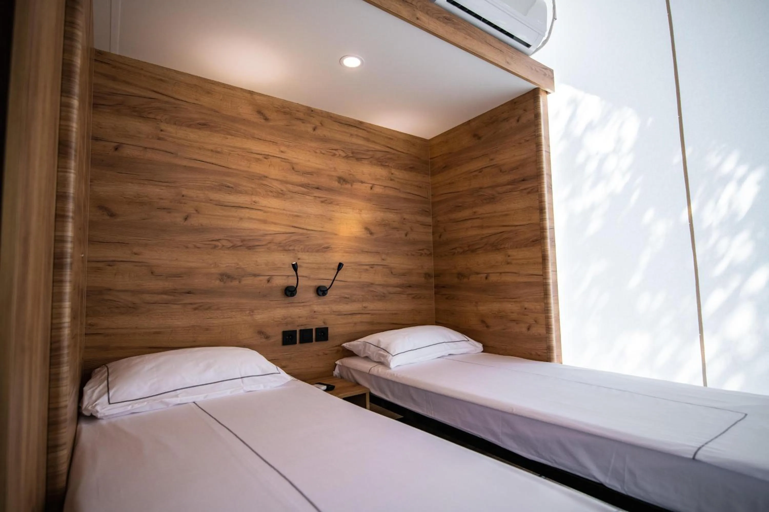 Bed in Arena One 99 Glamping