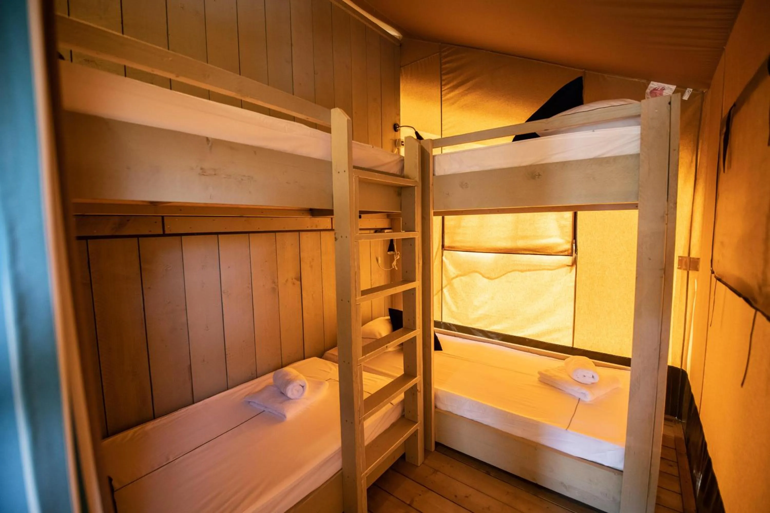 Bed in Arena One 99 Glamping