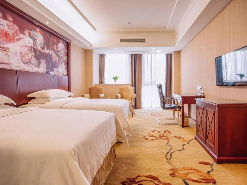 Bed in Vienna Hotel Jiangxi Yingtan International Glasses City
