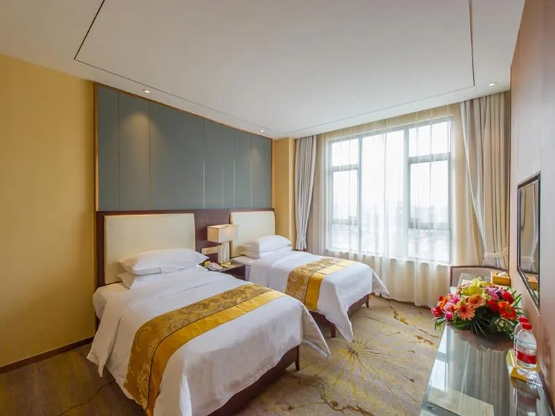 Bed in Vienna International Hotel Diecai Wanda High Speed ​​Rail Station