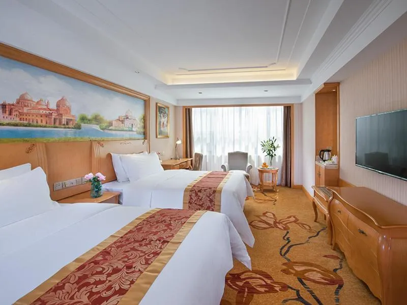 Bed in Venus International Hotel Shenzhen Gongming Tianhong