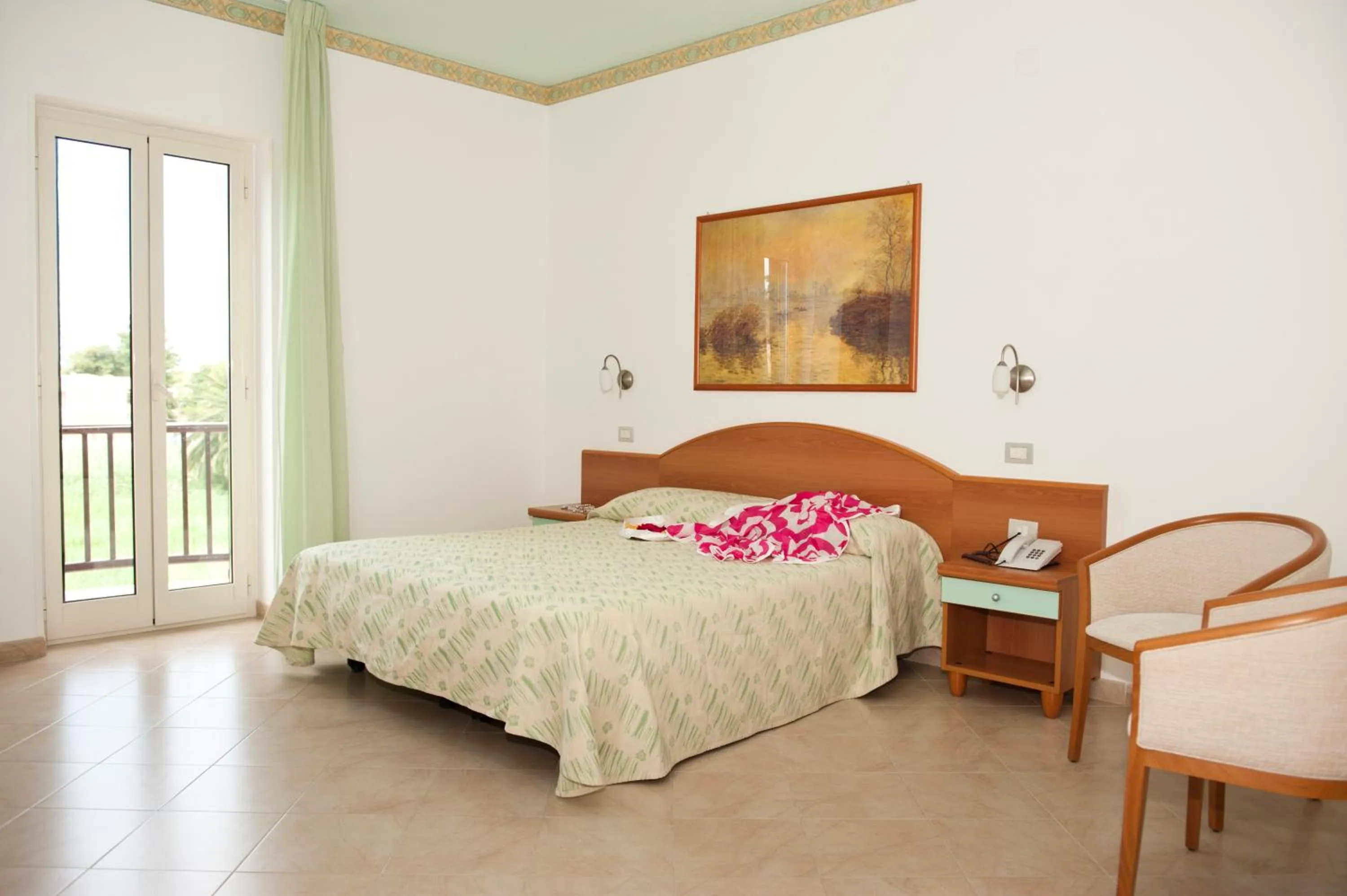 Bed in Oasiclub Hotel