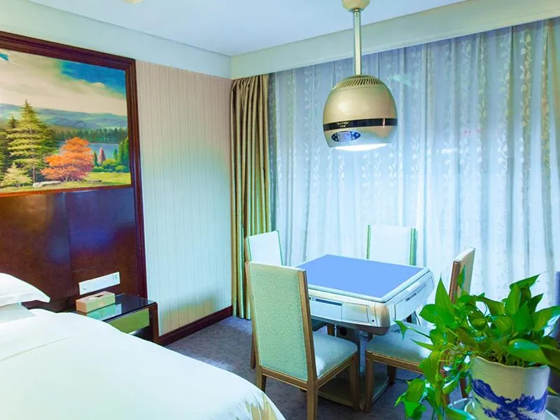 Bed in Vienna International Hotel Zhangjiajie Tianmen Mountain