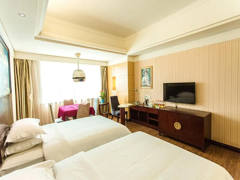 Bed in Vienna International Hotel Zhangjiajie Tianmen Mountain