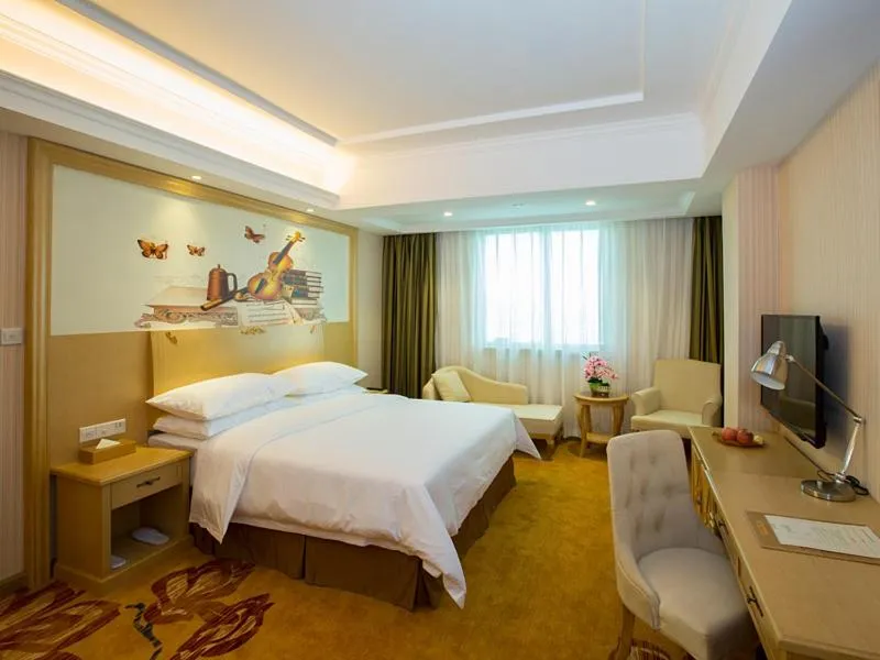 Bed in Vienna Hotel Huizhou Dahuxi