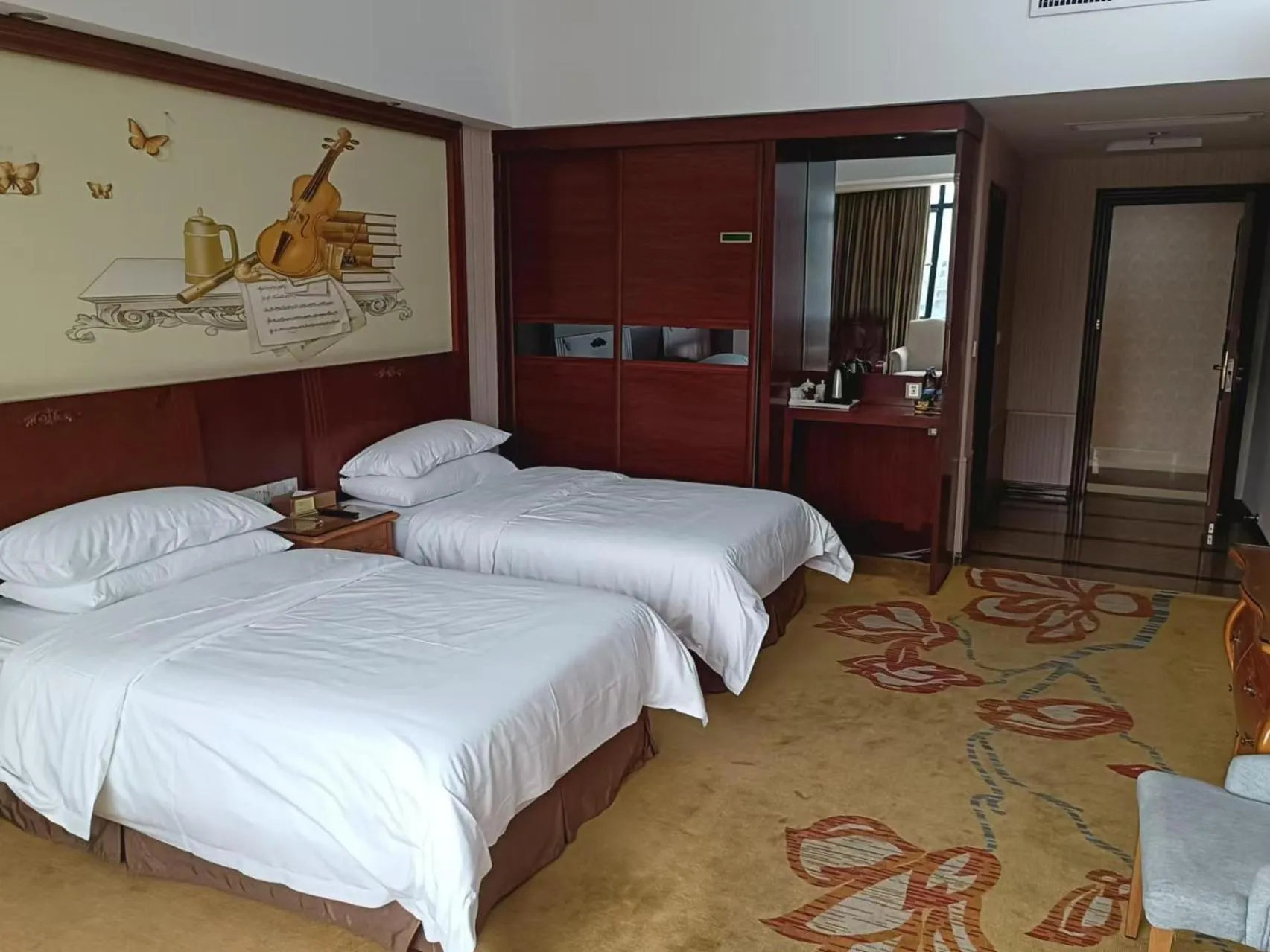 Bed in Vienna International Hotel Jieyang Jieyanglou