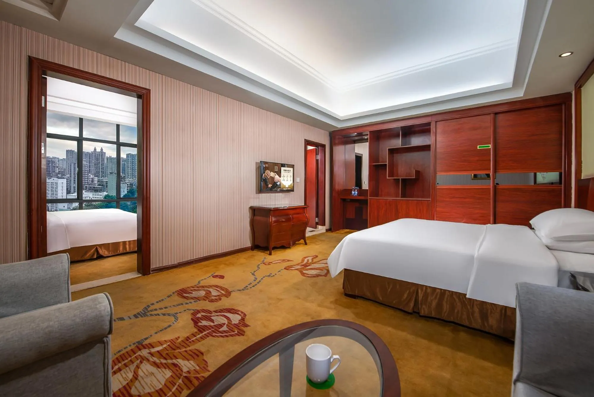 Bed in Vienna International Hotel Jieyang Jieyanglou