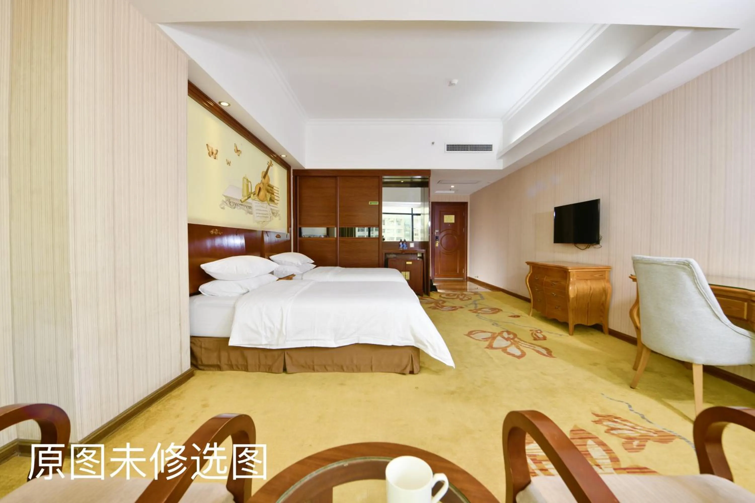 Bed in Vienna International Hotel Jieyang Jieyanglou