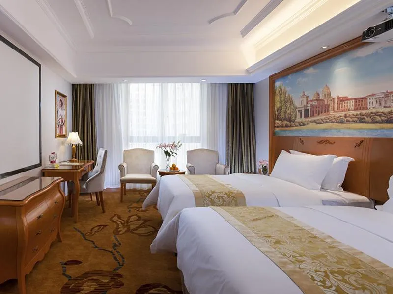 Bed in Vienna International Hotel Changsha Shumuling Subway Station