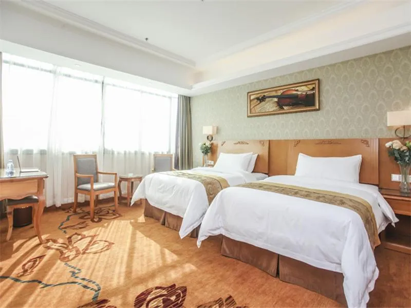 Bed in Vienna Hotel Fuzhou Linchuan Avenue