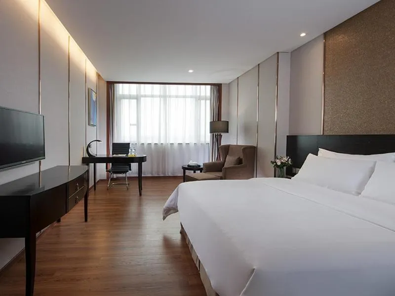 Bed in Vienna International Hotel Shantou Chenghai Waisha Bridge