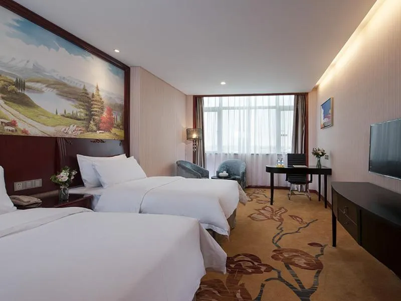 Bed in Vienna International Hotel Shantou Chenghai Waisha Bridge