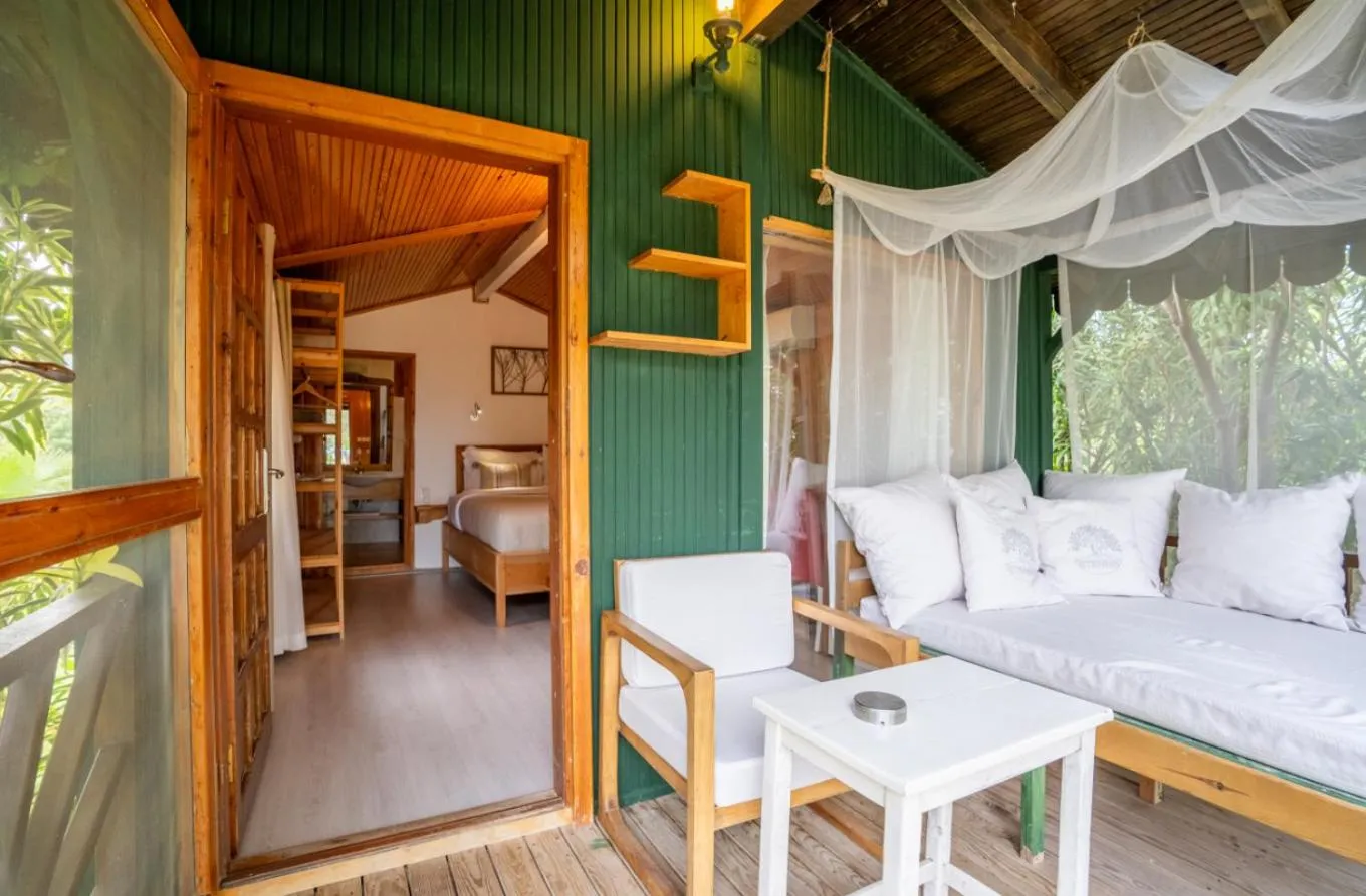 Bed in Etenna Beach Bungalows