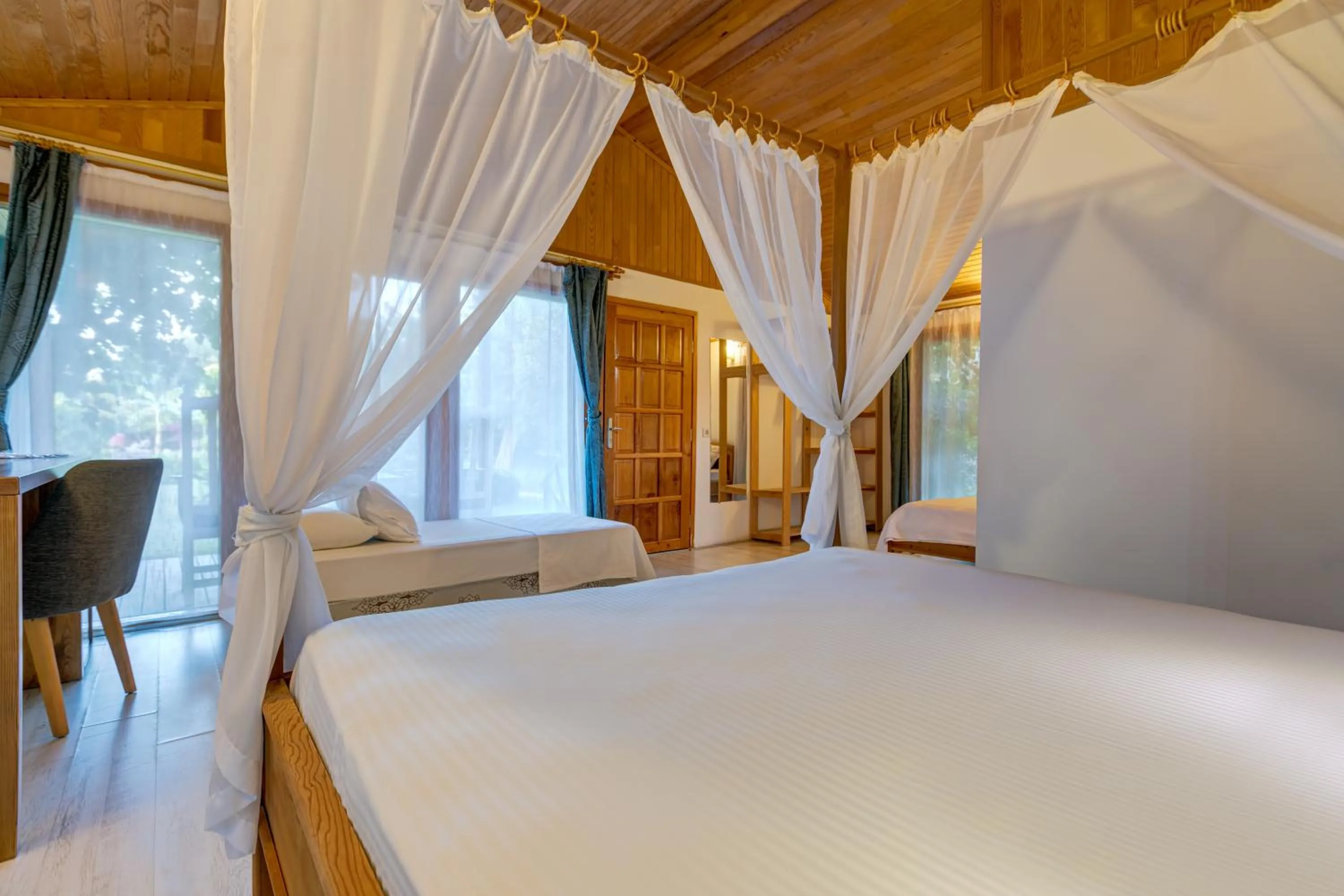 Bed in Etenna Beach Bungalows